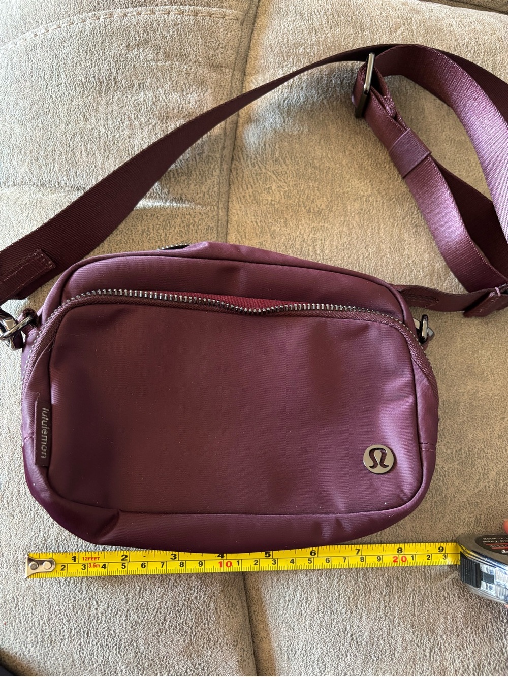 lululemon athletica Plum Crossbody Bag 2L with dark, polished granite hardware